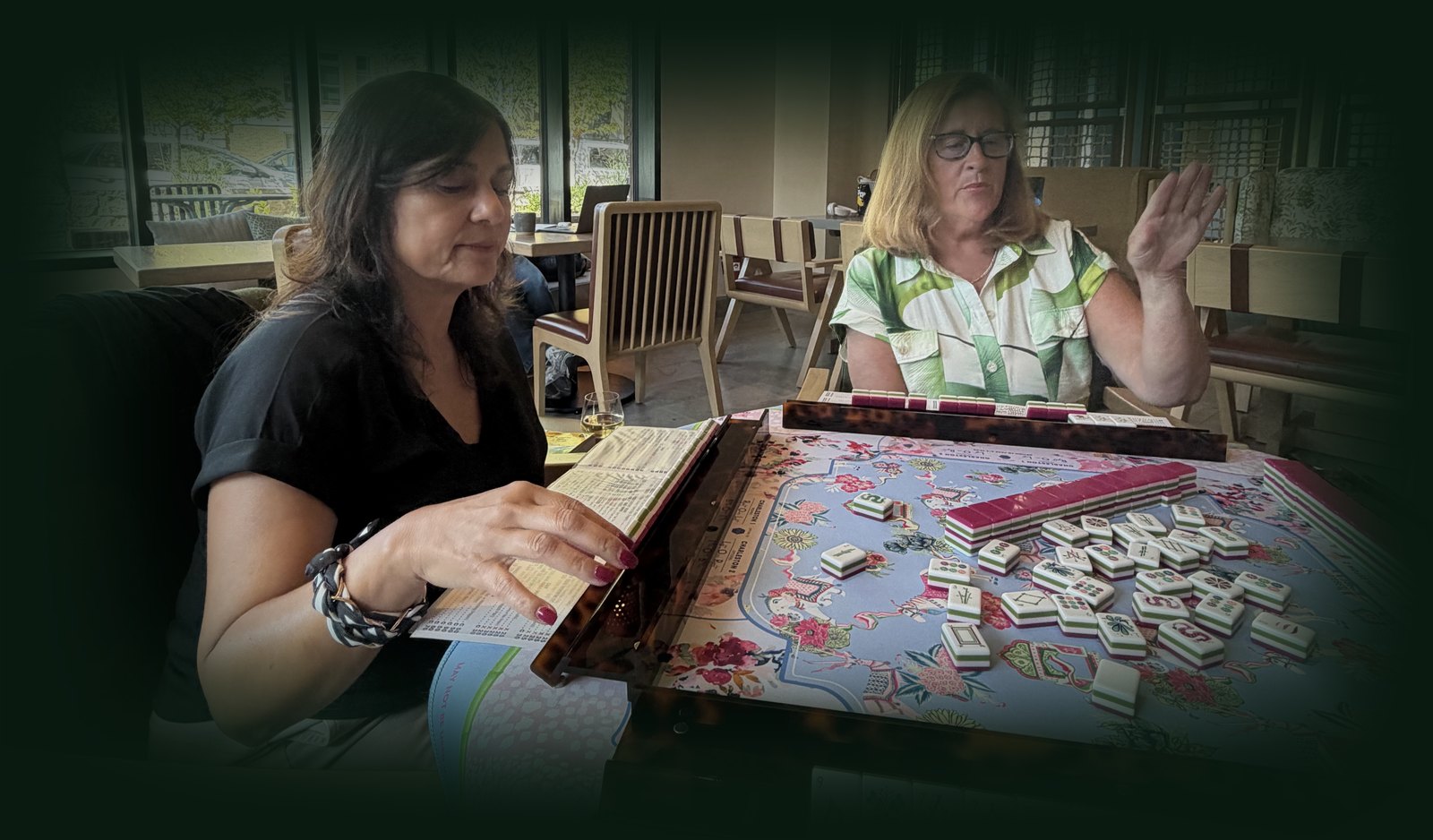 Maureen Cahill teaching American Mahjong at the table
